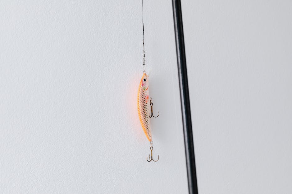 Detailed close-up of a fishing lure attached to a fishing rod, perfect for angling or fishing enthusiasts.
